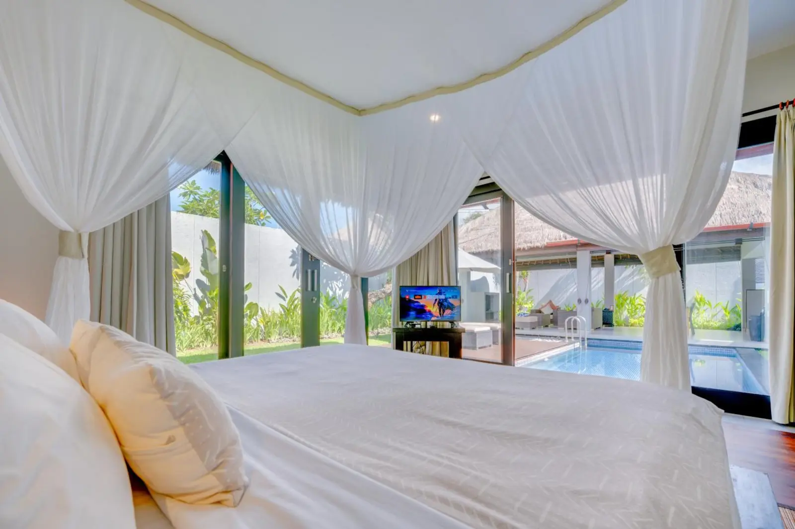 Bedroom with view of the pool at Villa Jerami & Spa