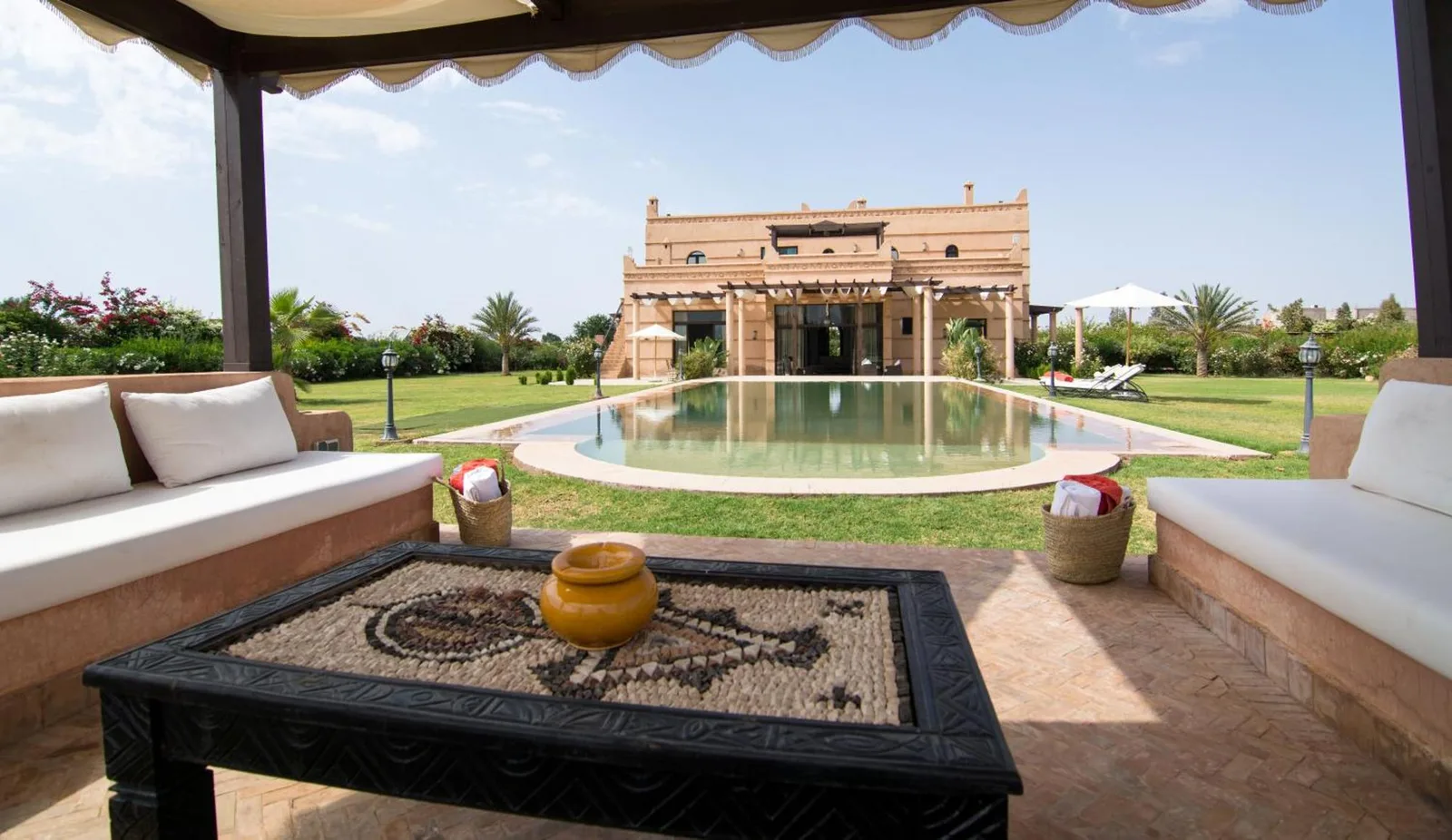 Lounge area overlooking the pool at Villas Fleurs Marrakech