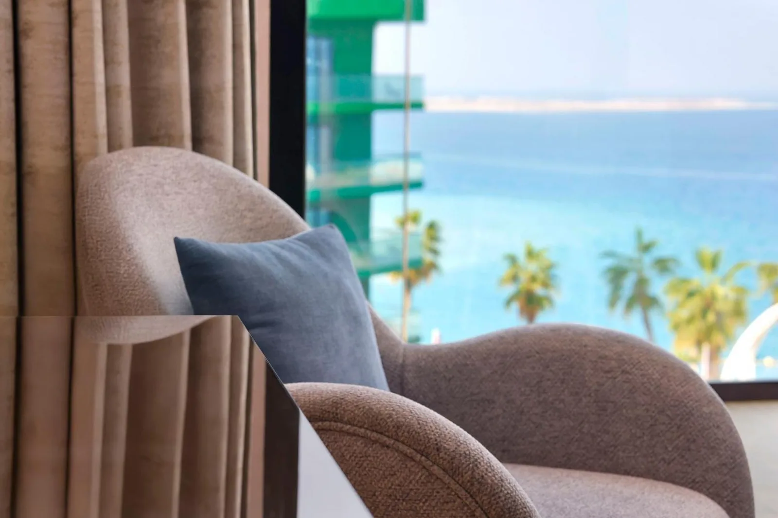 Cozy chair with sea view inside voco Dubai Nice The Heart of Europe by IHG in Dubai