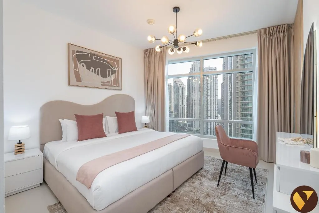 Vogue Vacation Homes elegant bedroom with city view