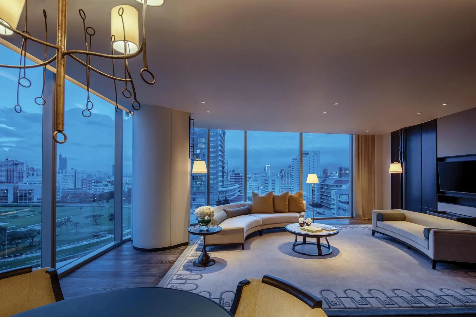 Dramatic evening view from living area at Waldorf Astoria Bangkok