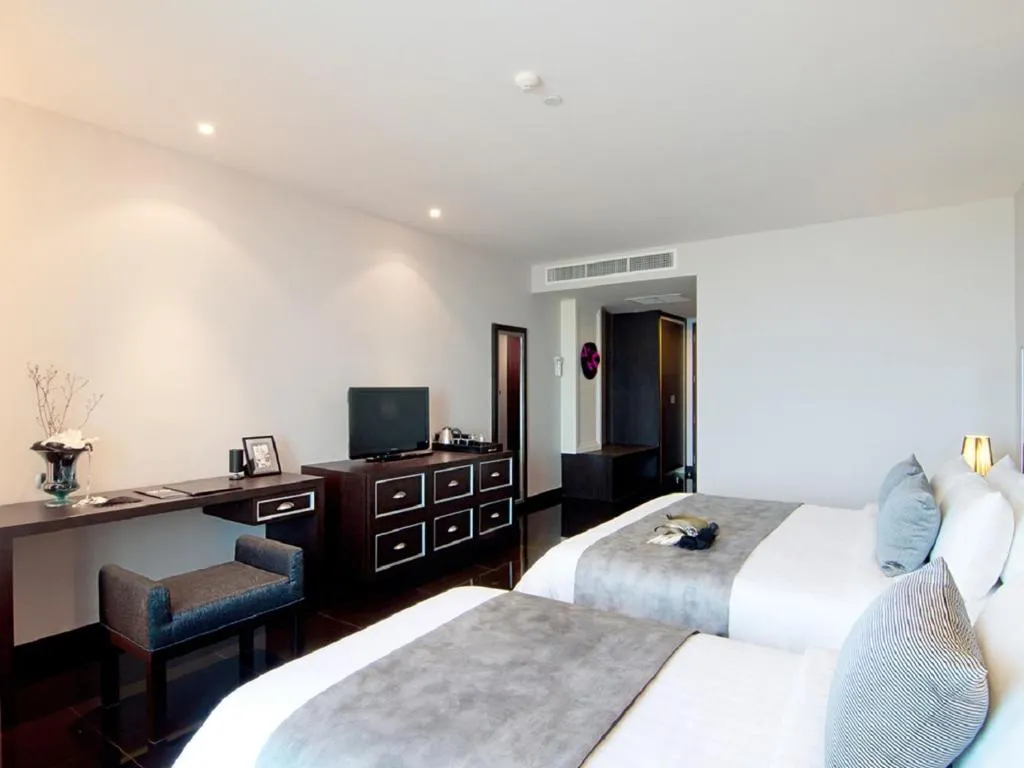 Way Hotel Pattaya room with modern amenities and twin beds