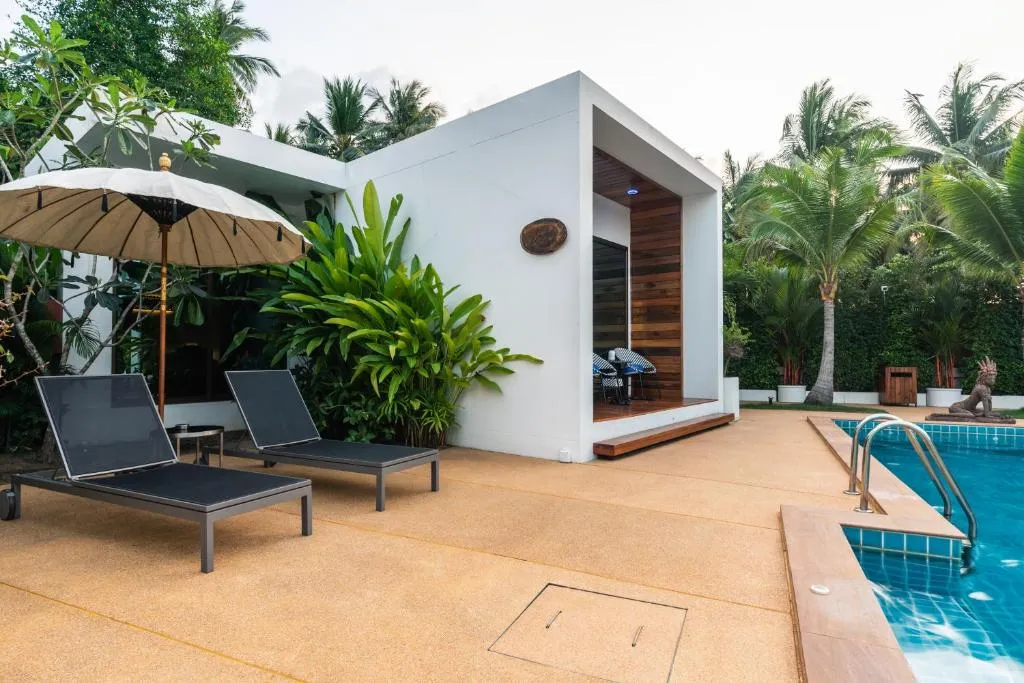 Zee Luxury Boutique Hotel lounge chairs by the pool in Koh Phangan