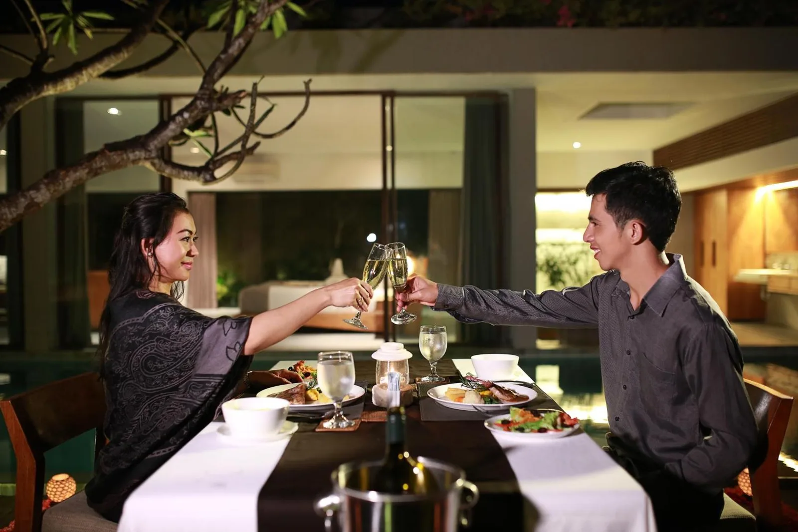 Ziva a Boutique Villa couple toasting at dinner