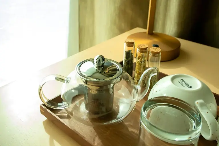 Tea set and cups in a guest room at Zoya Health & Wellbeing Resort in Ajman