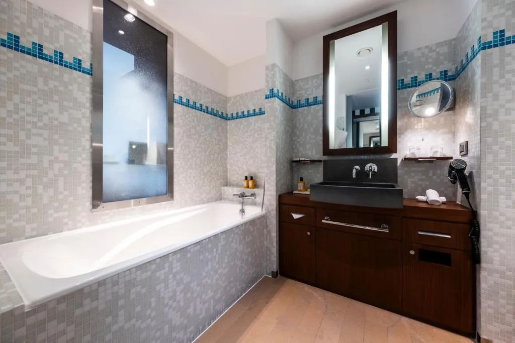 Spacious bathroom at Grand Hôtel Champs-Elysées in Paris