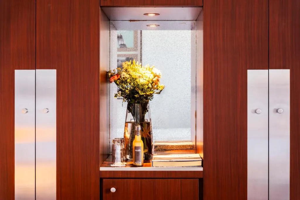 Mini bar area with flowers at Grand Hôtel Champs-Elysées in Paris