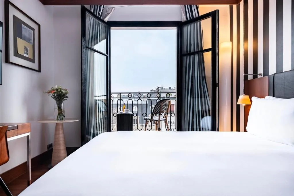 Guest room with balcony at Grand Hôtel Champs-Elysées in Paris