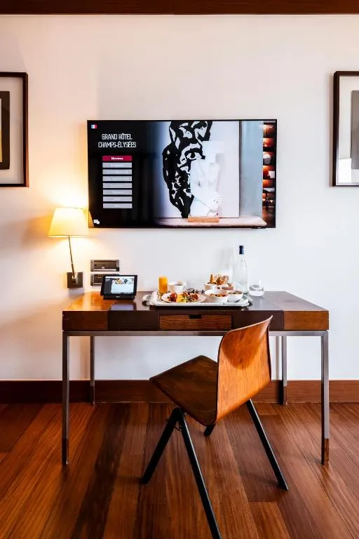 Work desk with amenities at Grand Hôtel Champs-Elysées in Paris